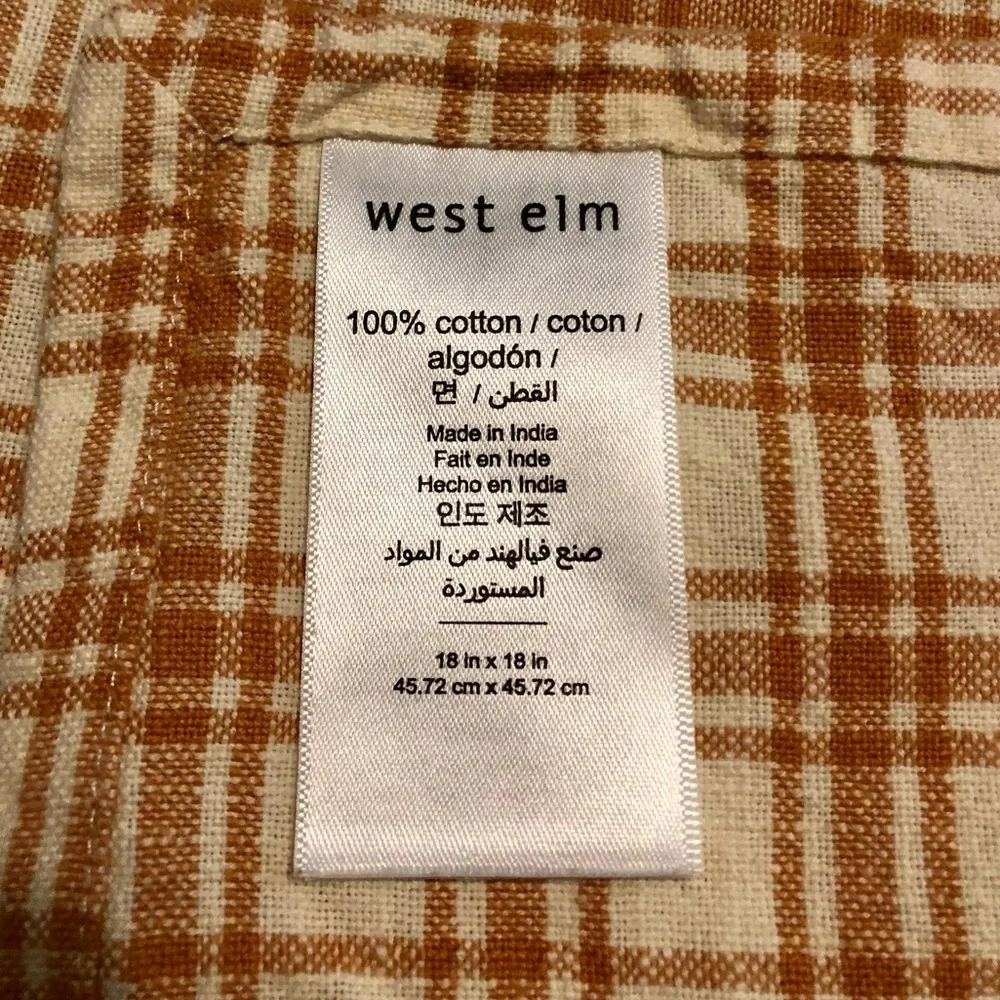 West Elm set of four orange and white checked cloth napkins